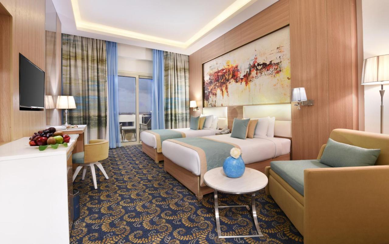 Tolip Gardens Hotel ไคโร ภายนอก รูปภาพ A room at the hotel
